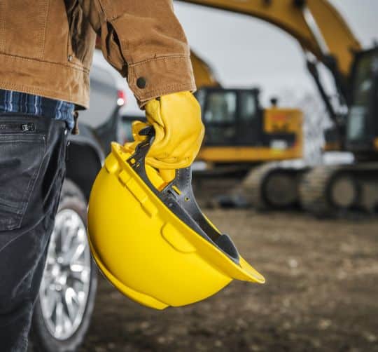 man w hard hat on construction site